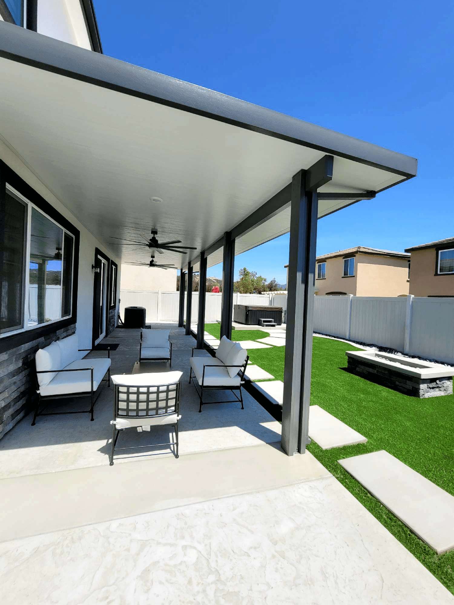 Modern insulated aluminum patio cover with clean white and graphite finish
